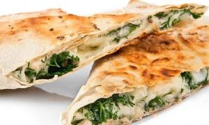 Lavash roll with cheese and herbs in the oven